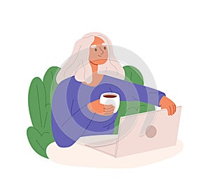 Woman freelancer, remote worker work on laptop with coffee cup at home workplace or coworking space