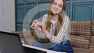 Woman freelancer works on laptop, monitoring stock online earning bitcoins by trading operations