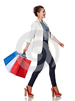 Woman with French flag colours shopping bags going to side