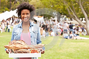 Woman With Fresh Bread Bought At Outdoor Farmers Market