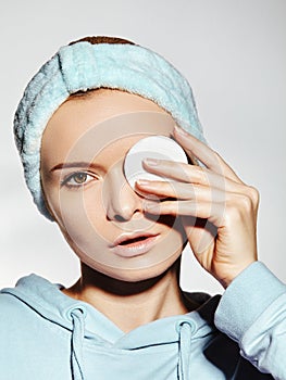 Woman with Fresh Clean Face use Cotton Pad for Make-up Removal. Morning Hygiene, Daily Beauty facial, skin care routine