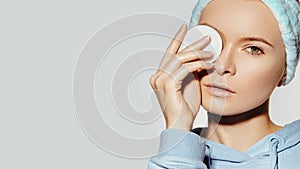 Woman with Fresh Clean Face use Cotton Pad for Make-up Removal. Morning Hygiene, Daily Beauty facial, skin care routine