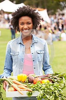 Woman With Fresh Produce Bought At Outdoor Farmers Market