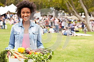 Woman With Fresh Produce Bought At Outdoor Farmers Market