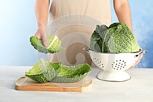 Woman with fresh savoy cabbage