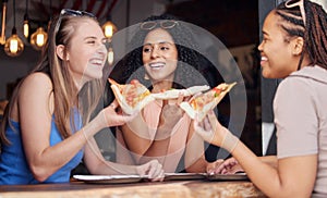 Woman, friends and laughing with pizza for funny joke, meme or conversation together at restaurant. Happy hungry women