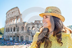 Woman in front of colosseum in rome, italy