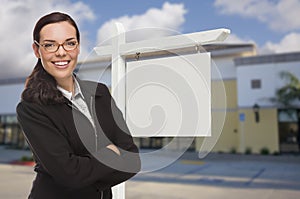 Woman In Front Commercial Building and Blank Real Estate Sign