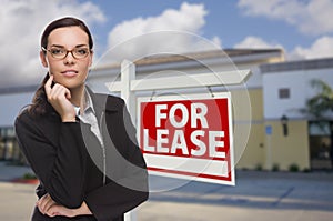 Woman In Front of Commercial Building and For Lease Sign