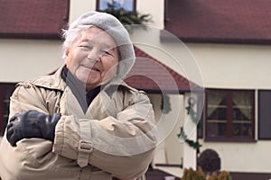 Woman in front of the house.