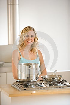 Woman in front of a kitchen