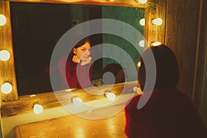 Woman in front of mirror in dressing room