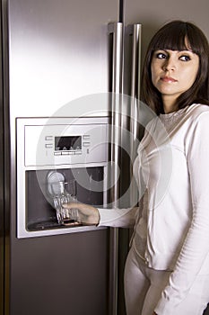 Woman in front of refrigerator