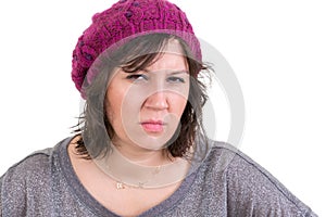 Woman frowning in disbelief with an assessing look