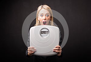 Woman frustrated by weight scales