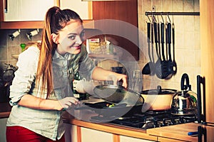 Woman frying frozen vegetables. Stir fry.