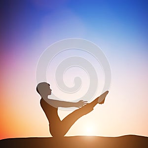 Woman in full boat yoga meditating at sunset. Zen