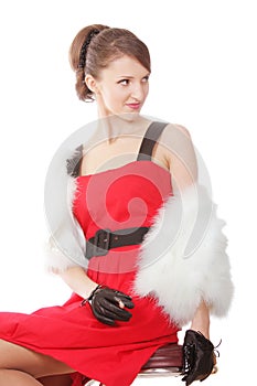 Woman in fur coat with cigarette sitting on chair