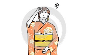 Woman in furisode put her hand on her head in distress photo