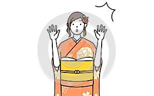 Woman in furisode raising her hand in surprise photo