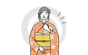 Woman in furisode tapping her chest photo