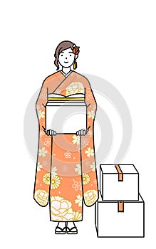 Woman in furisode working to carry photo