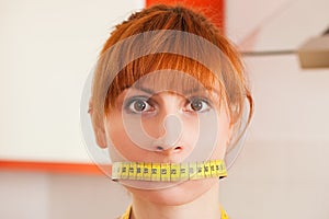 Woman gagged by a tape measure