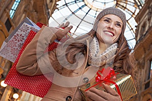 Woman in Galleria Vittorio Emanuele II looking into distance