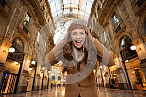 Woman in Galleria Vittorio Emanuele II rejoicing start of sales