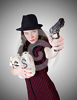 Woman gangster with handgun on the white