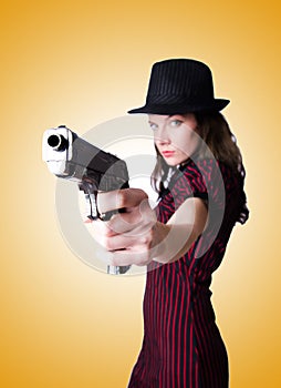 Woman gangster with handgun on white