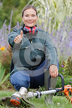 woman gardener smiling with thumb up