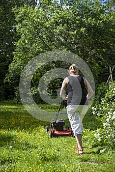 Woman gardening in back yard