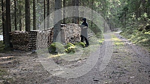 Woman gathering chopped woods