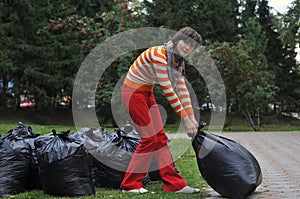 Woman gathering garbage in the park