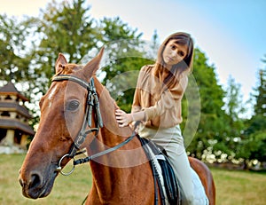 A woman gently stroking a horse on a grassy field amidst rural landscapes. A portrait of a young jockey highlights farm training