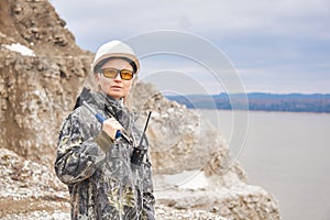 Woman geologist at the edge of the quarry