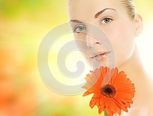 Woman with gerbera flower