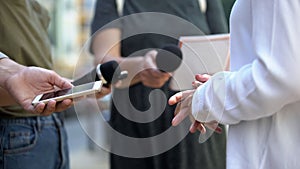 Woman gesticulating during interview with media, press conference, close-up photo