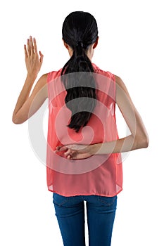 Woman gesturing against white background