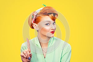 Woman gesturing a no sign. serious pinup retro style girl raising finger up saying oh no photo