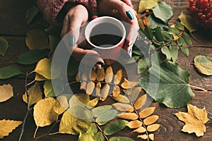 Woman get warmth with tea on the autumn background