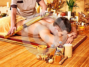 Woman getting bamboo massage.