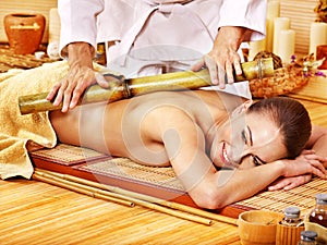 Woman getting bamboo massage.