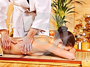 Woman getting bamboo massage.