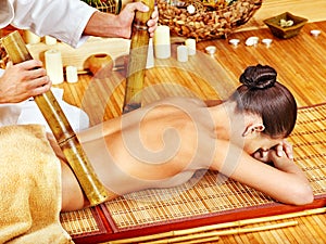 Woman getting bamboo massage.