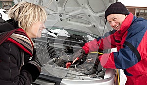 Woman getting a boost for her car photo