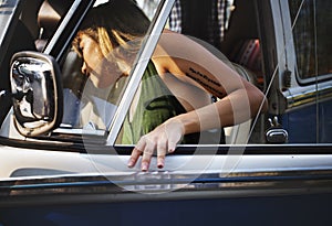 Woman Getting in a Car on Front Seat of The Car Road Trip Travel