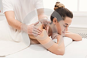 Woman getting classical back and neck massage