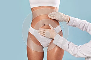 Woman getting consultation at plastic surgery clinic